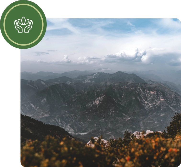 A view of mountains from the top of a mountain.